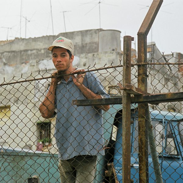 Man at Fence, Havana, Cuba, 1999 ©Cyndie Burkhardt.